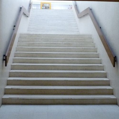 Staircase leading to Swiss Cottage library interior