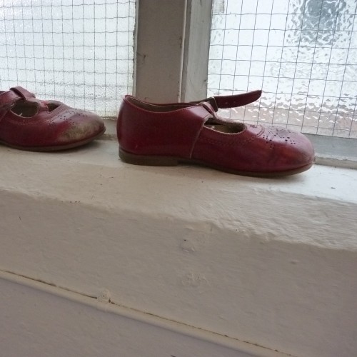 Children's shoes on the window sill
