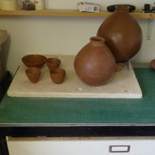 Some of Allan's pots on a plan chest